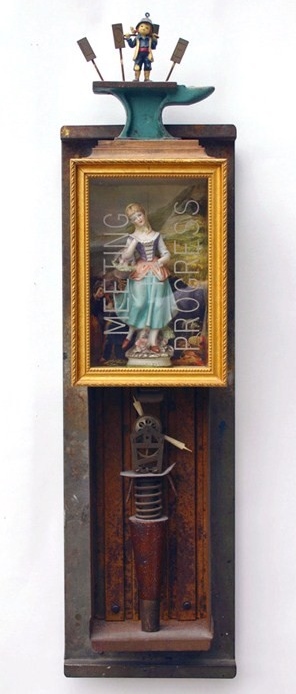 ceramic and wood figures in frames