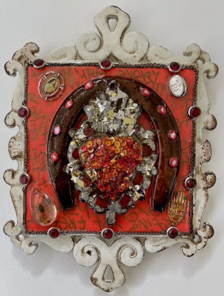 sacred heart of sequins inside a horseshoe, graffiti style text, scorpion in resin, religion embellishments, in white iron frame