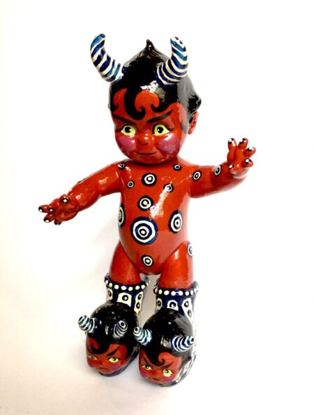 devil baby doll, with a likeness head on each foot